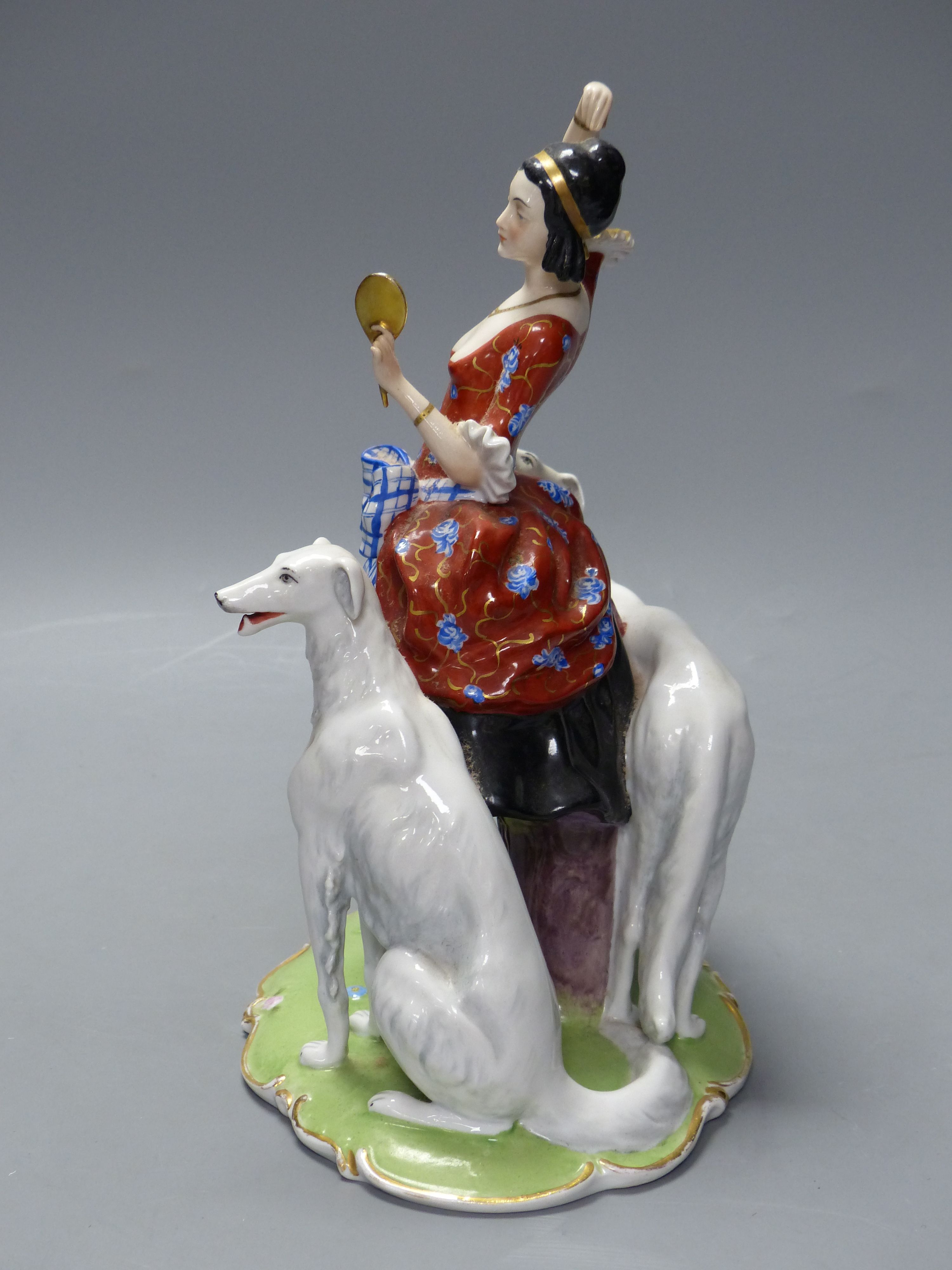 An Art Deco Fraureuth group modelled as a lady wearing a red gown flanked by two Borzoi dogs, H 28cm